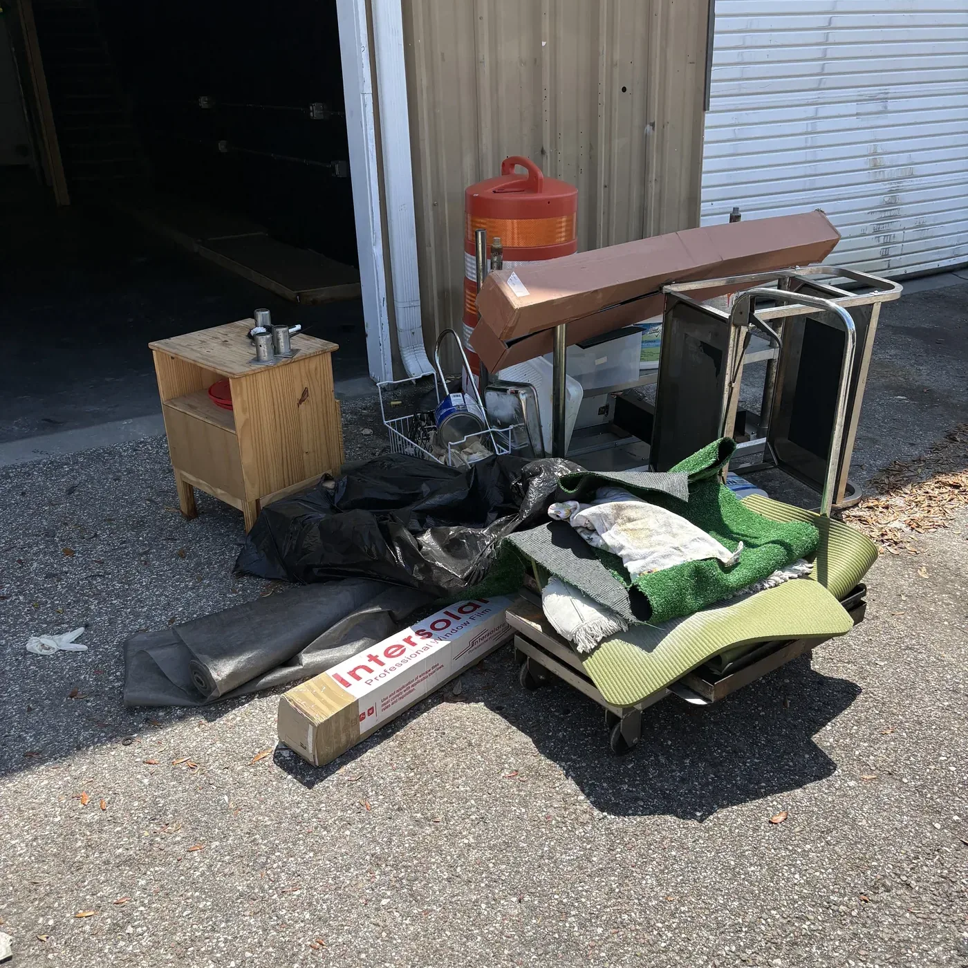 Bin Bandits crew clearing office chairs from a commercial space
