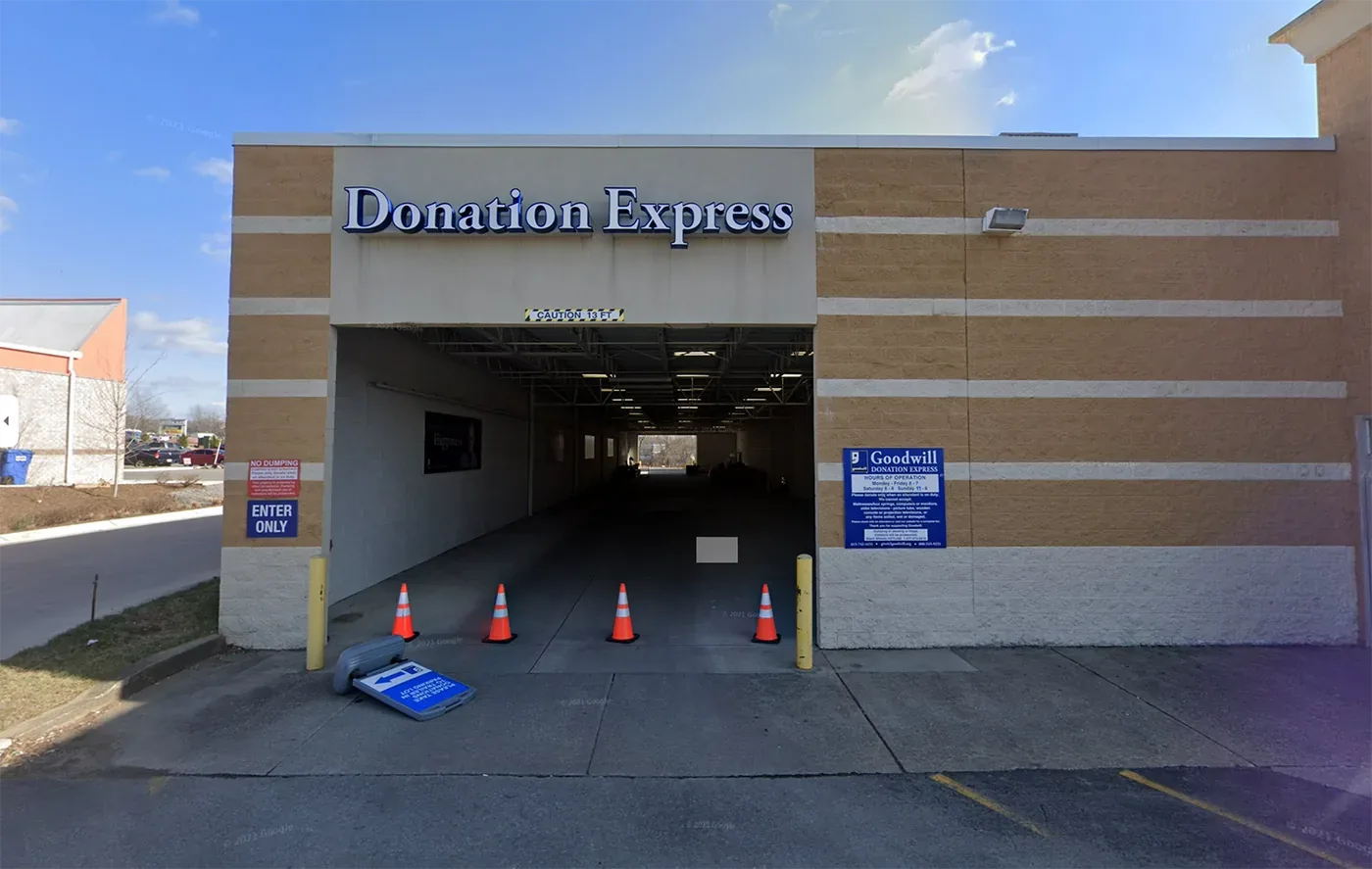 Crew member dropping off household goods at a local donation center